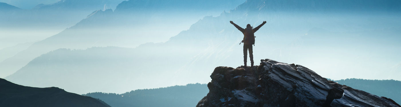 A group of employees invites visitors to learn more about USAble Life.