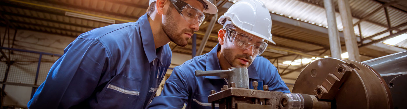Young adult looking over their membership via a tablet, while listneing to music