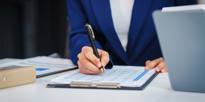 Two brokers working on a portfolio