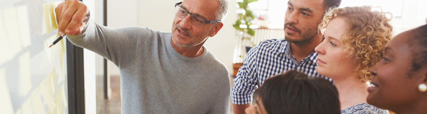 An employer tells his employees about USAble Life benefits