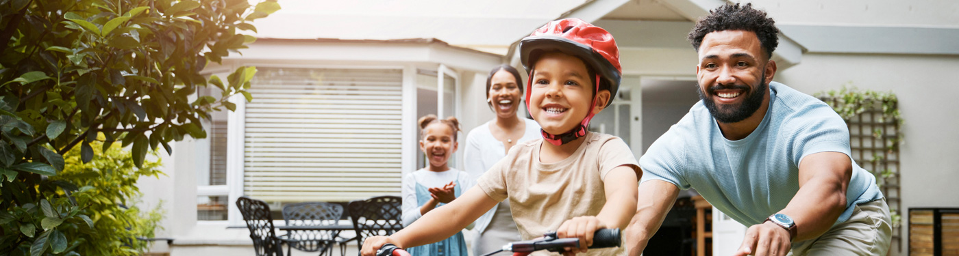 A grandmother and her daughter enjoying a moment together while flying a kite with USAble Life insurance plans